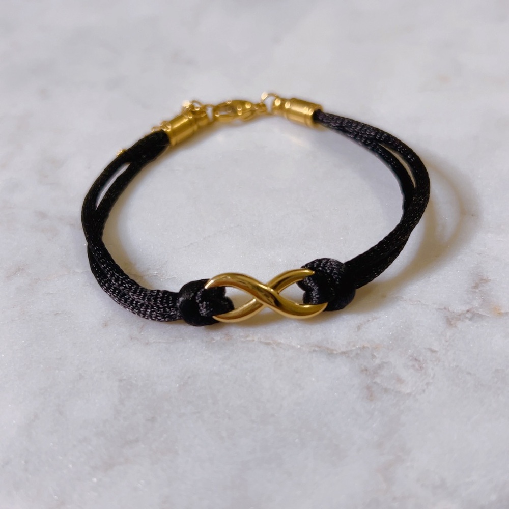 CELINE13 Infinity Charm Bracelet – Black Cord & Polished Titanium Steel‎